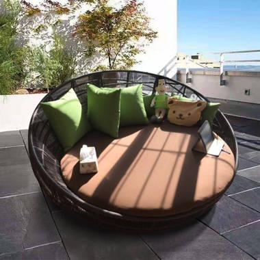 Rattan round online lounger